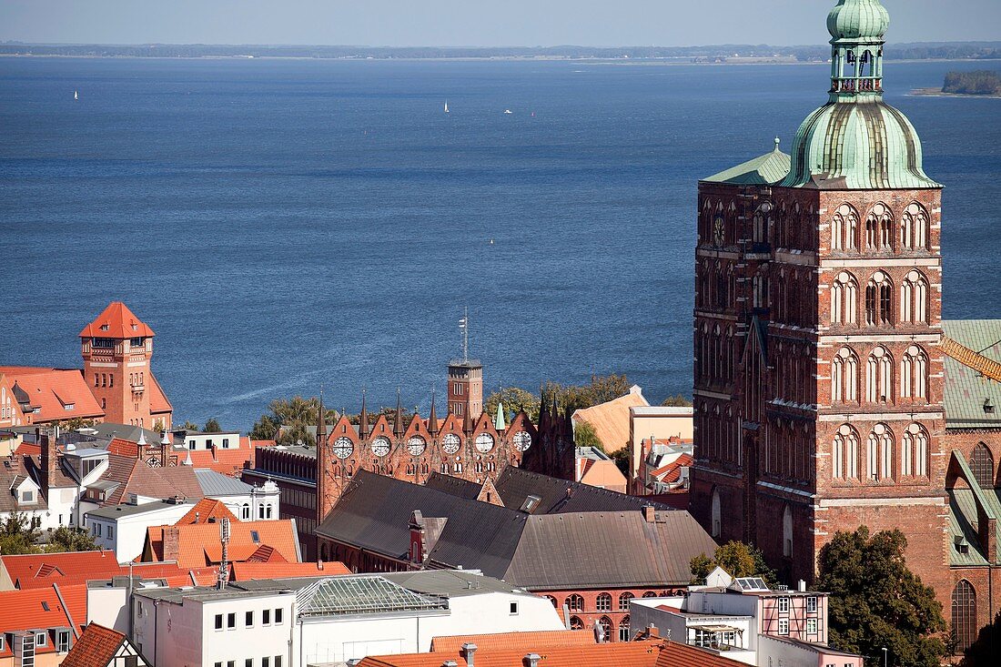 church tower of St  Nicolass church, the historic centre and the blue Baltic Sea, Hanseatic City of Stralsund, Mecklenburg-Vorpommern, Germany
