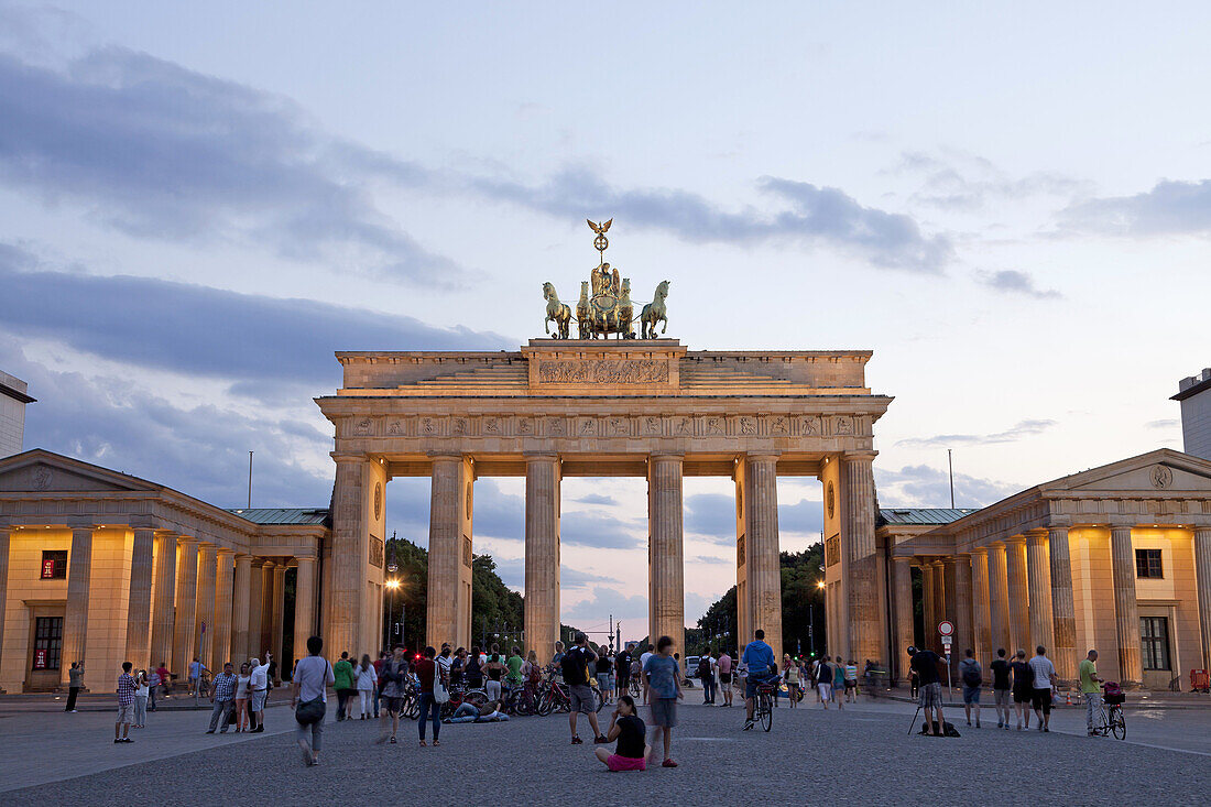 the illuminated Brandenburg Gate and square Pariser Platz in Berlin, Germany, Europe.