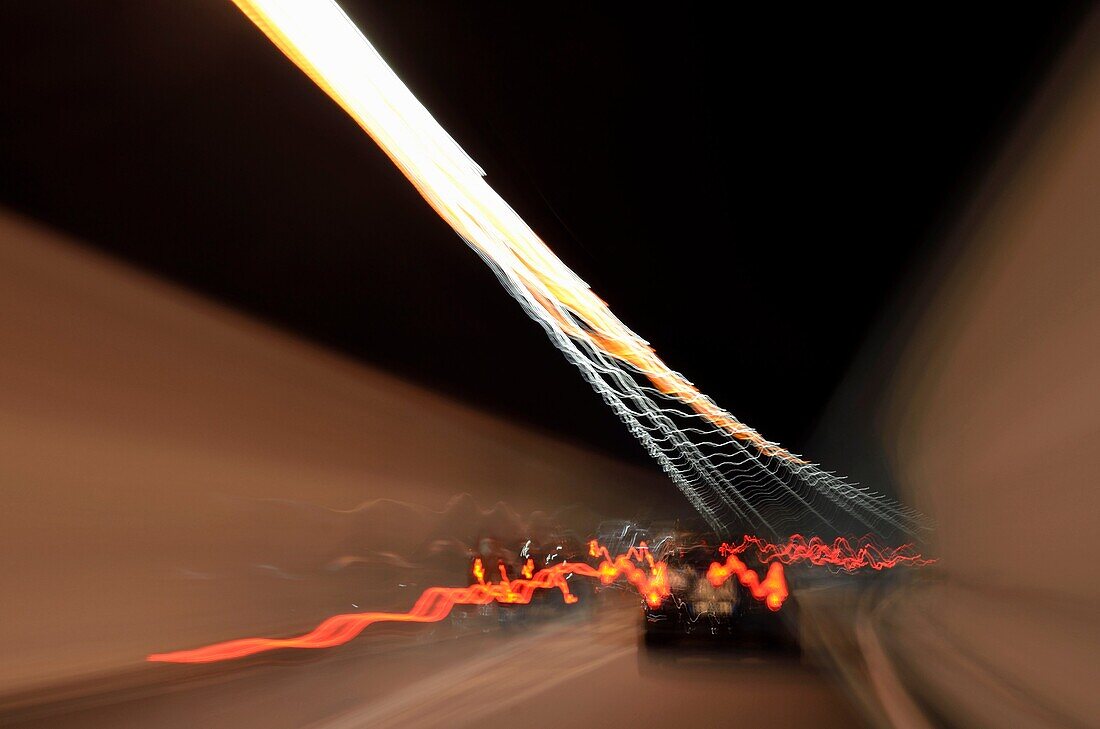 Speeding car inside a highway tunnel, Italy, blurred motion