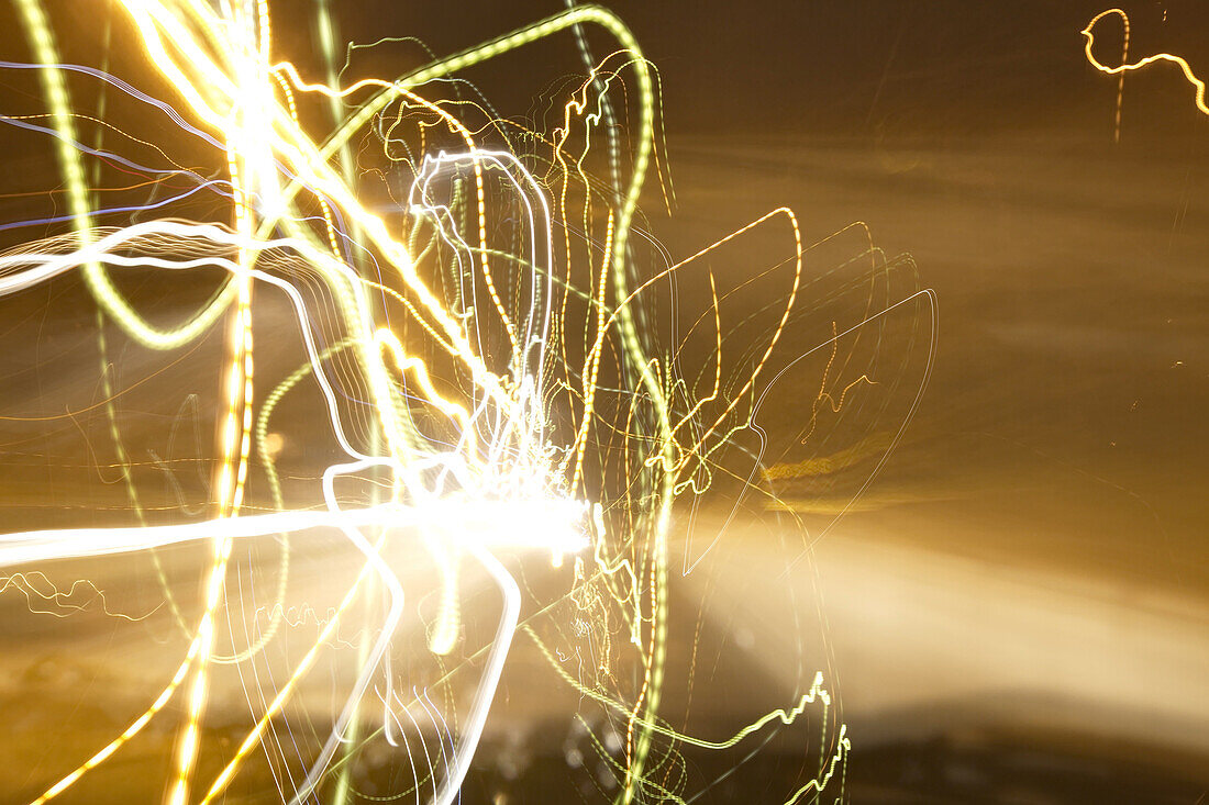 Cars driving on an ice-covered street, blurred.