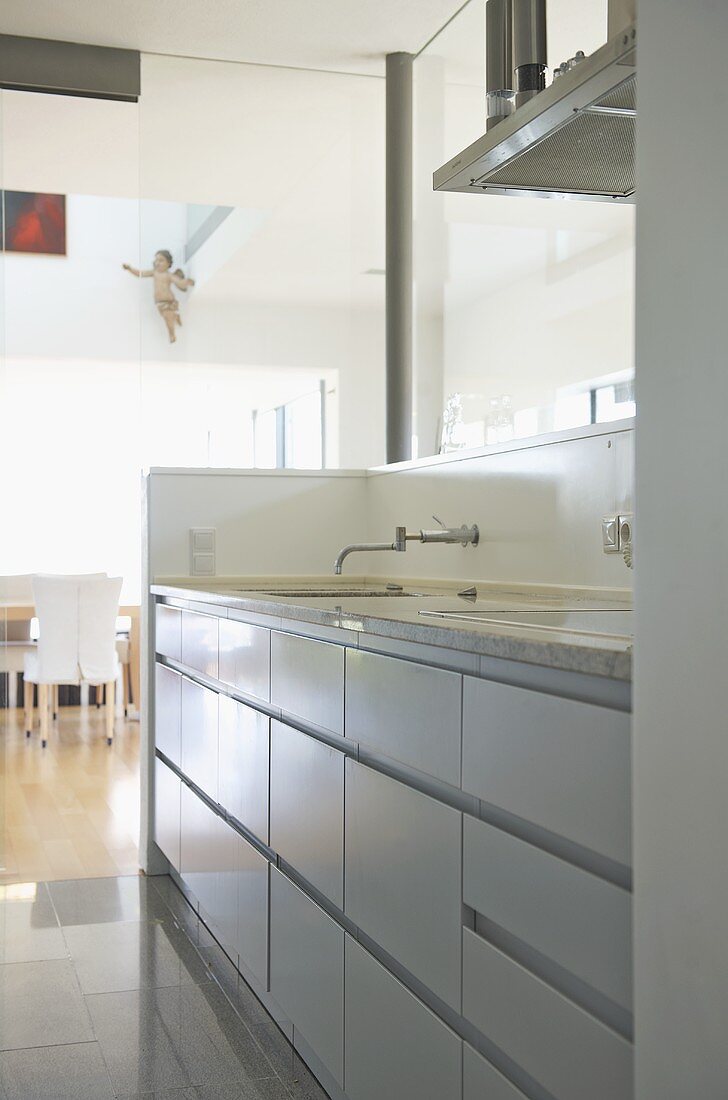 Sink set in fitted unit in modern kitchen