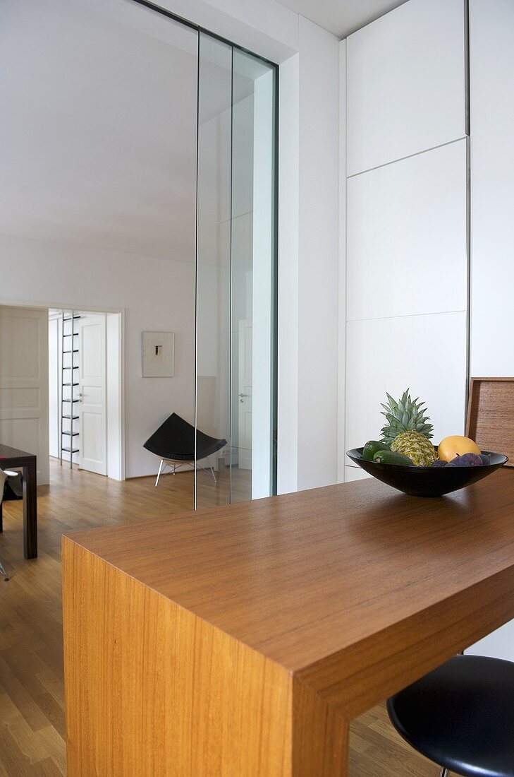 Bar stool at breakfast bar in modern kitchen