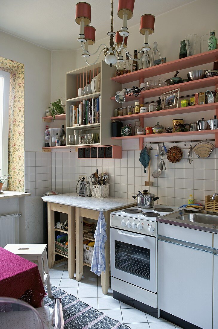 Shelving above oven and fitted unit in modern kitchen