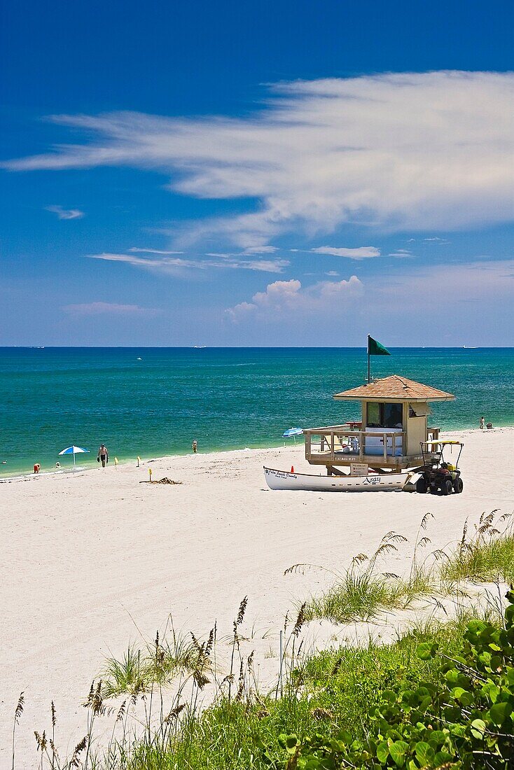 lifeguard huts with rescue boat and dune buggy, stakes with yellow tags marking turtle nests, Juno Beach, one of the most productive sea turtle nesting sites in the world, Florida, Atlantic Ocean