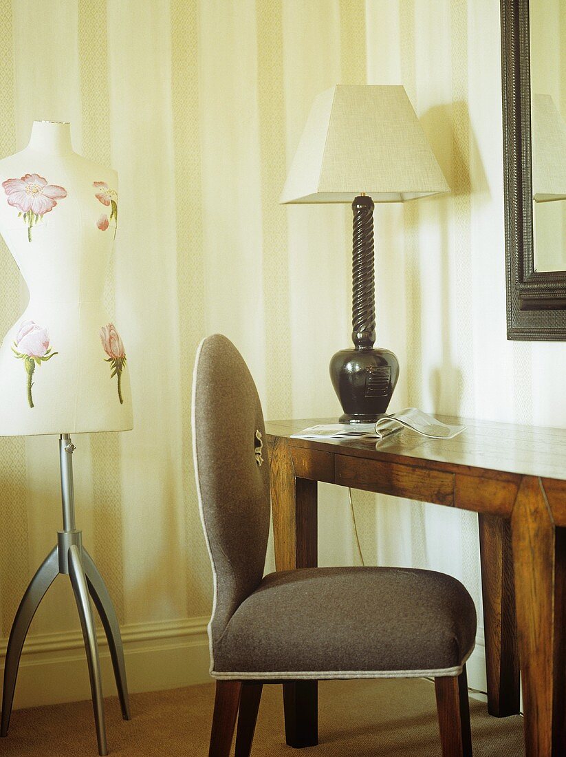 Simple brown upholstered chair and wooden table