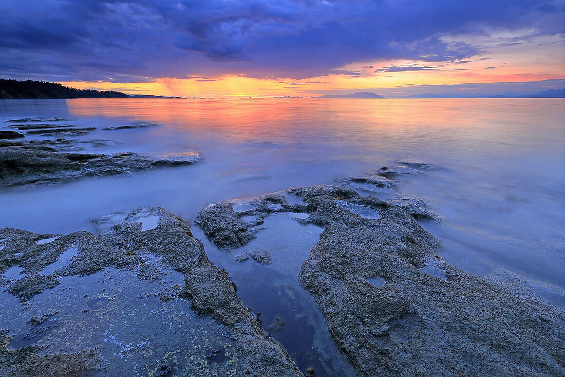 Long exposure shoreline scenic over Georgia Strait, north Nanaimo, Vancouver Island, British Columbia.