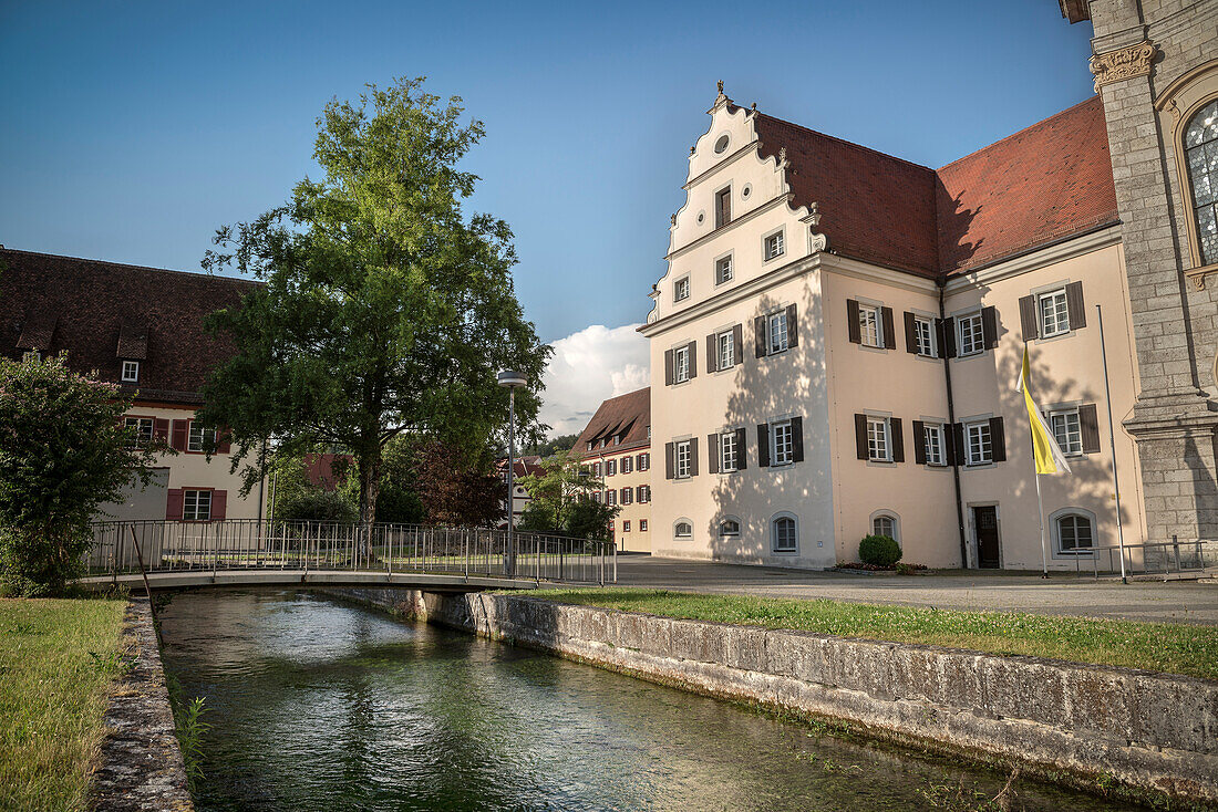 Zwiefalten Monastry with rivulet in front, Swabian Alb, Baden-Wuerttemberg, Germany