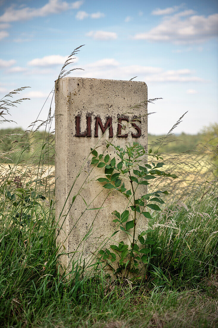 Stone marking the course of the former Limes border, Limes (border wall of Roman Empire), Ostalb province, Swabian Alb, Baden-Wuerttemberg, Germany, UNESCO world heritage site