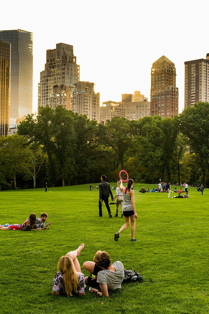 People relaxing on the Sheep Meadow, Central Park, Manhattan, New York, USA