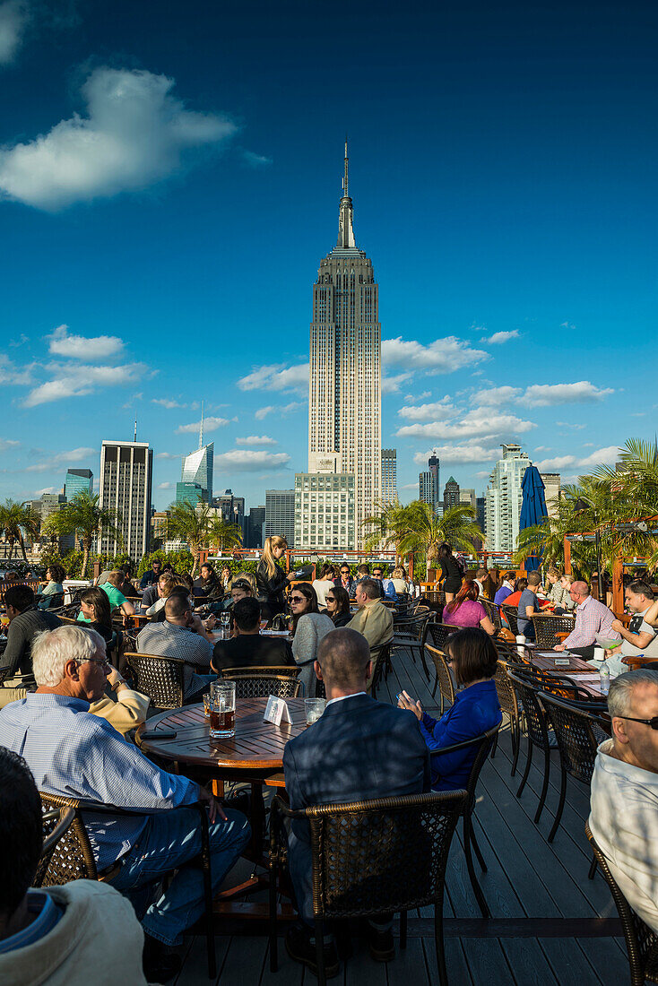 Rooftop bar and Empire State Building, Midtown, Manhattan, New York, USA