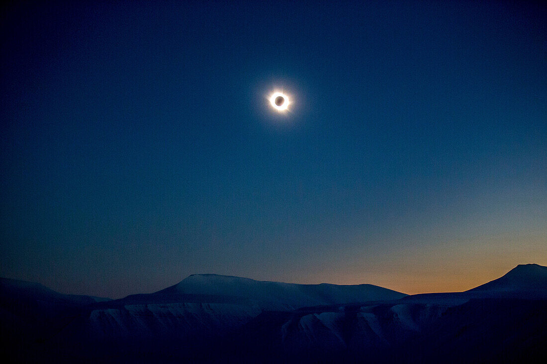 Snowy mountains at the total solar eclipse Spitzbergen, Svalbard, Norway