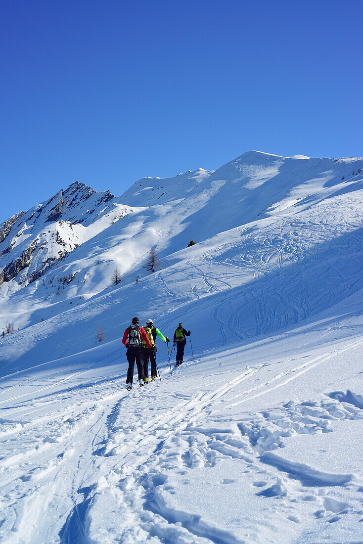 Three persons back-country skiing ascending towards Gammerspitze, Gammerspitze, valley of Schmirn, Zillertal Alps, Tyrol, Austria
