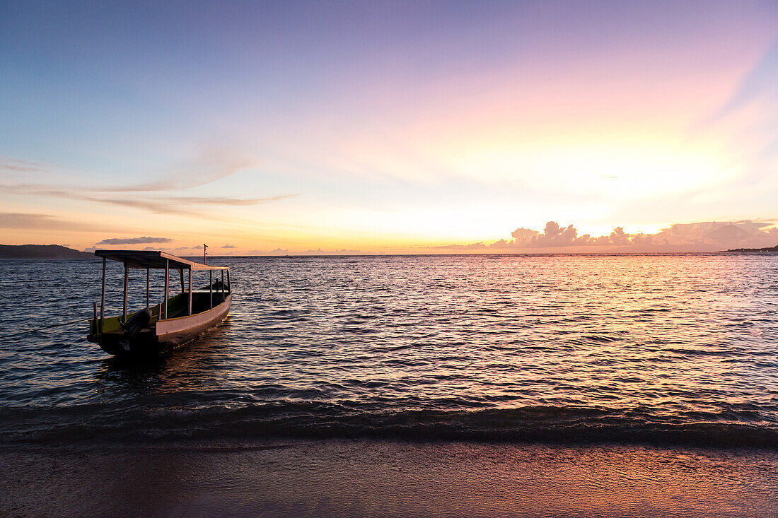 Fishing boat at beach in sunset, Gili Meno, Lombok, Indonesia