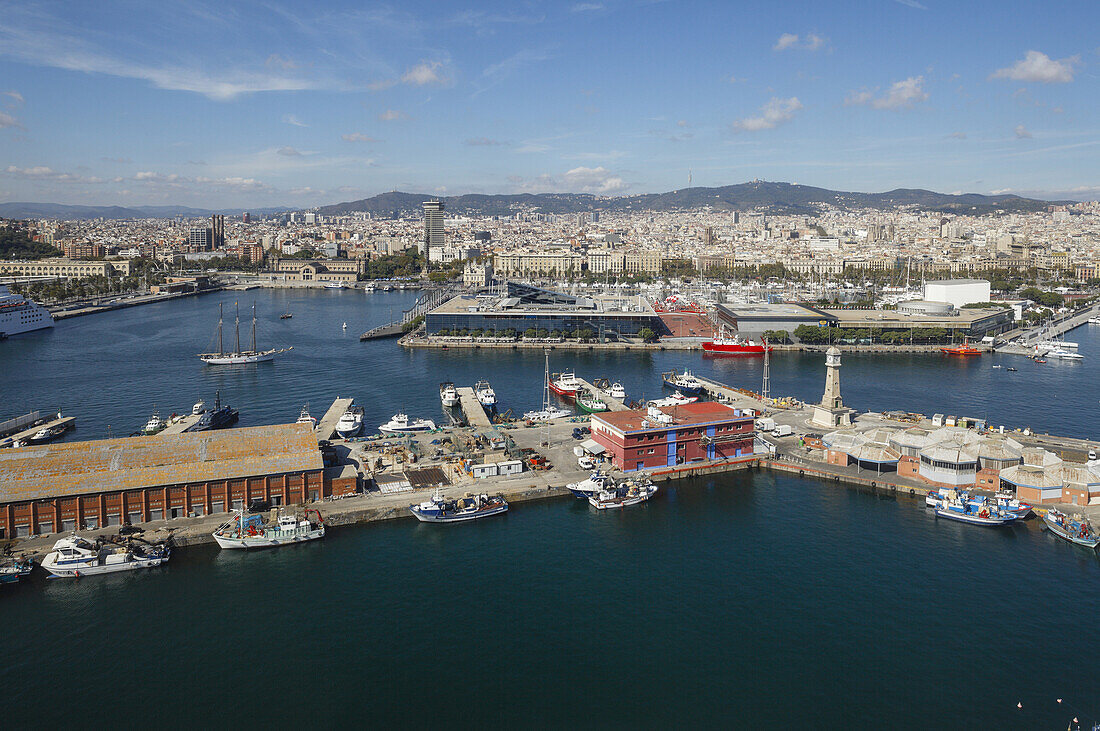 view across the harbour and town, fishing Port, Maremagnum shopping centre, Port Vell, Barcelona, Catalunya, Catalonia, Spain, Europe