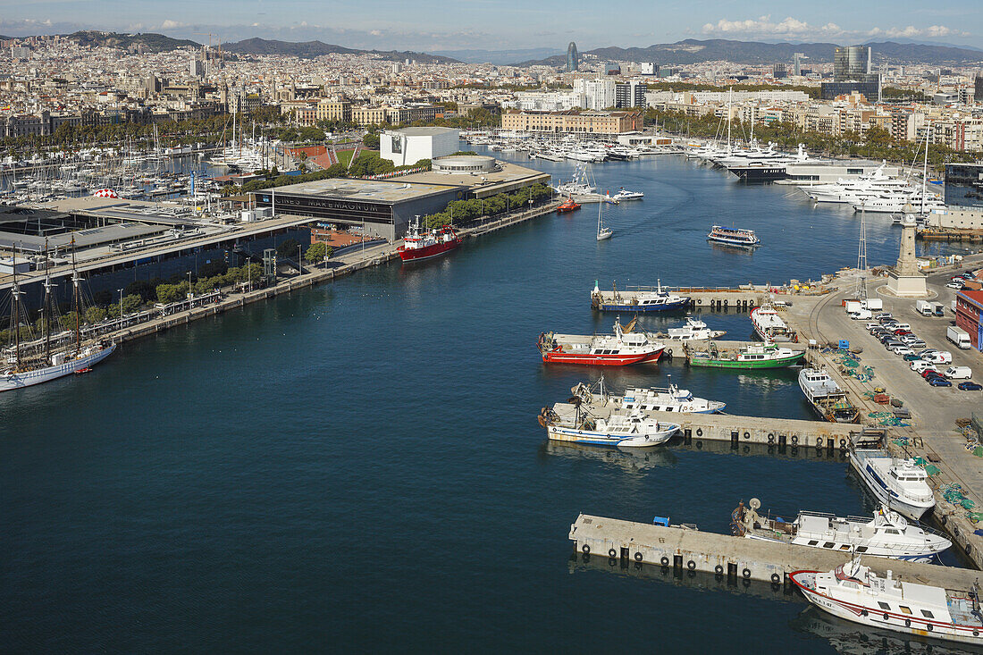 view across the harbour and town, fishing Port, Maremagnum shopping centre, Port Vell, Barcelona, Catalunya, Catalonia, Spain, Europe