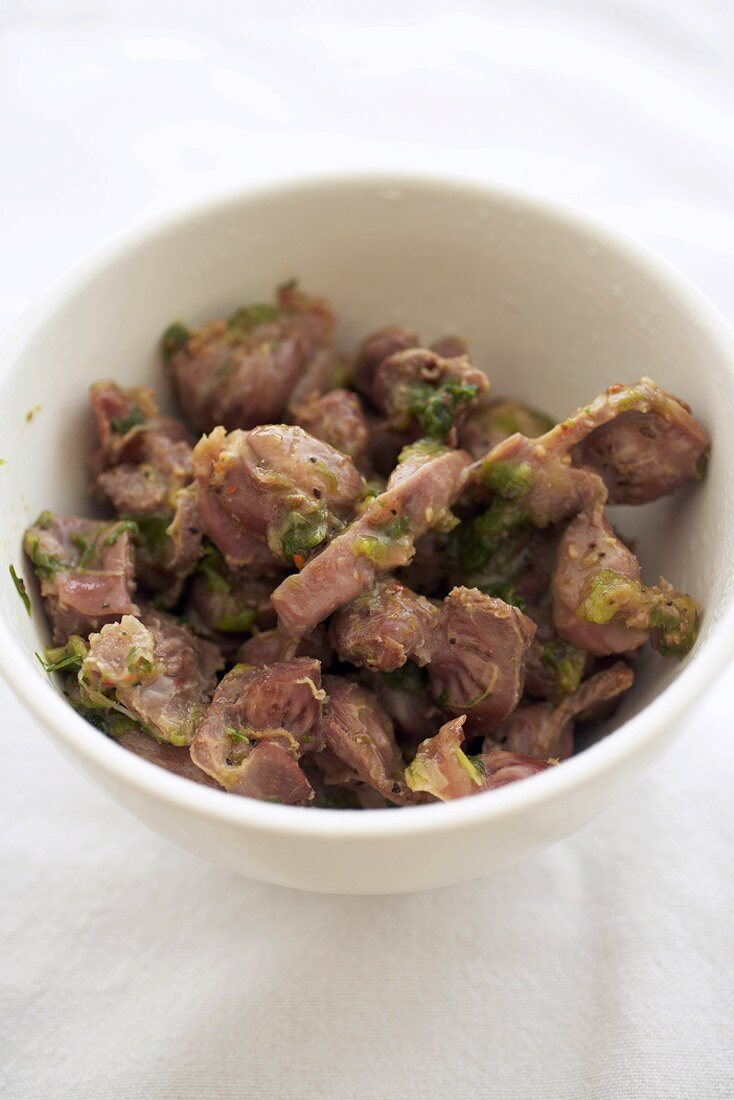 Bowl of Chicken Gizzards Sauteed with Spices and Shallots