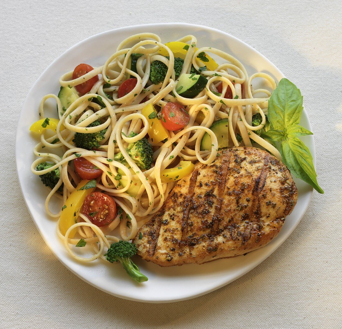 Grilled Chicken Breast with Pasta Primavera on a Plate