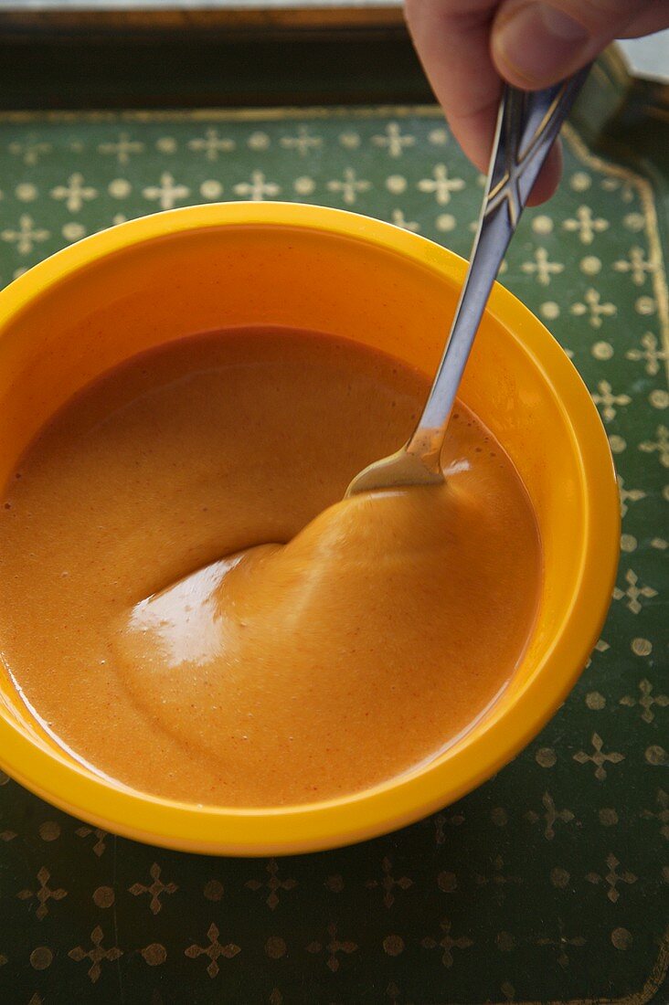 Stirring a Bowl of Homemade French Dressing