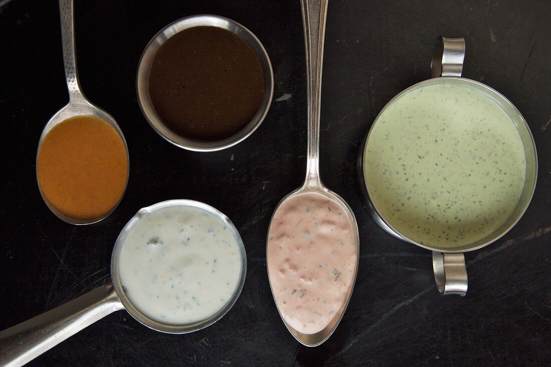 Bowls and Spoonfuls of Assorted Homemade Dressings, Overhead