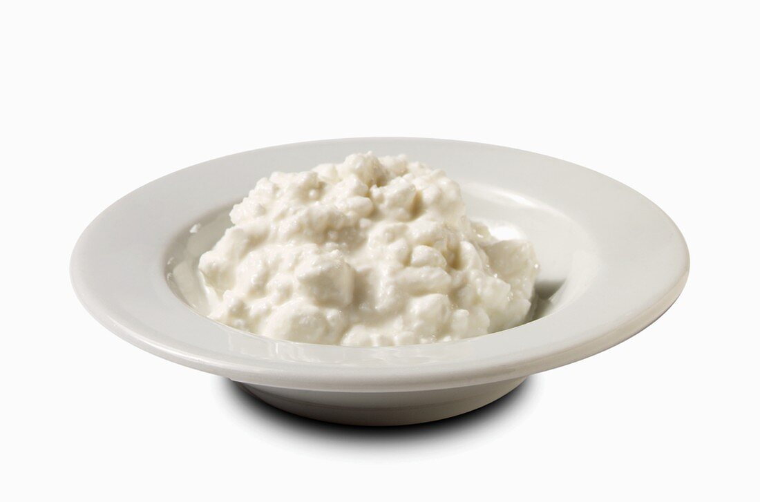 A Bowl of Cottage Cheese on White