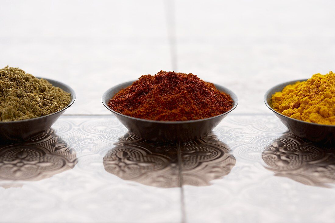 Three Small Bowls of Ground Spices