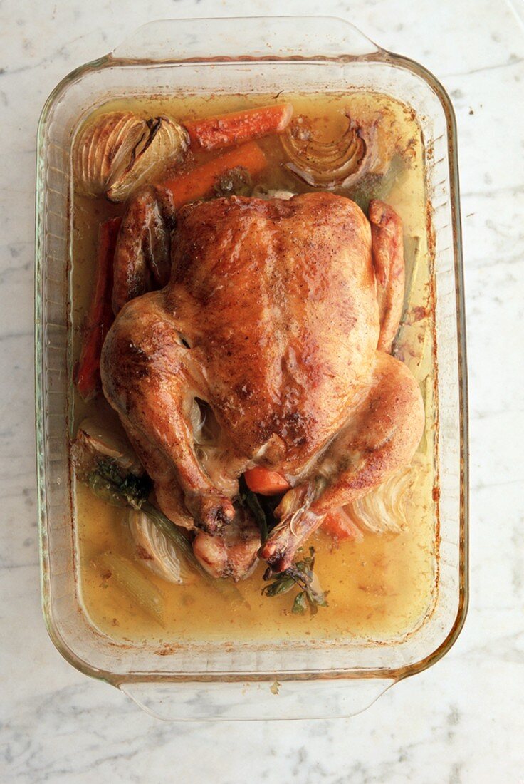 Roasted Chicken in a Glass Baking Dish with Vegetables