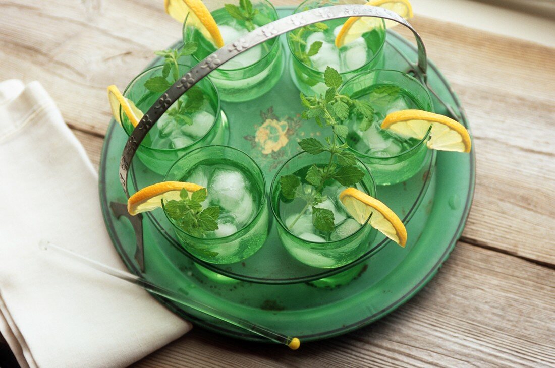 A Tray of Cocktails with Lemon and Mint