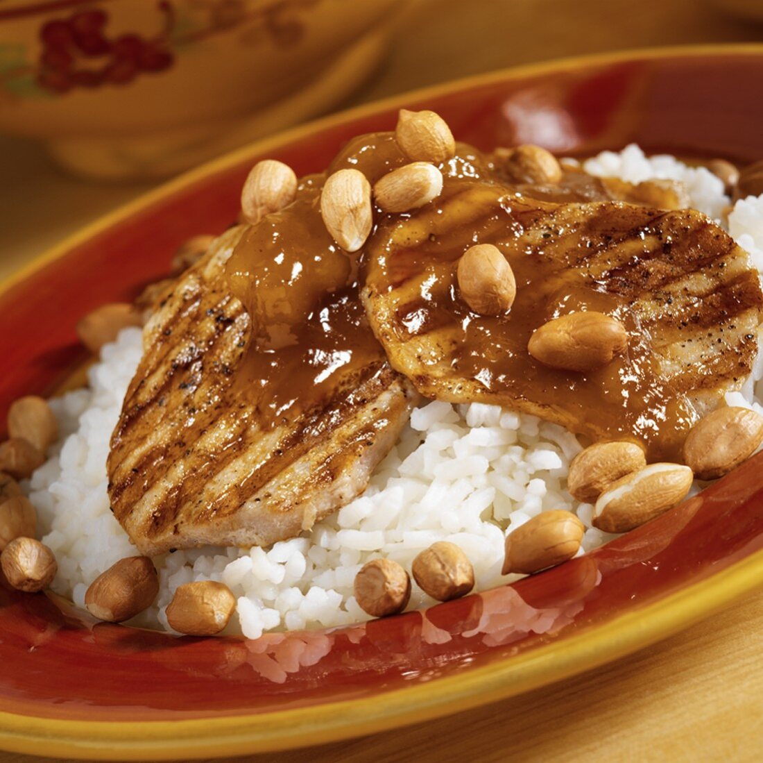 Grilled Pork Medallion Over Rice with Chutney and Peanuts