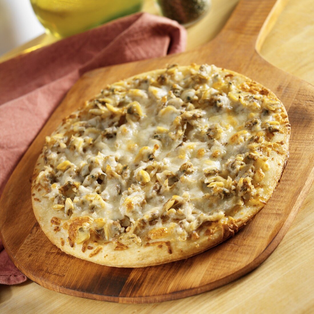 Clam Pizza on a Wooden Pizza Peel