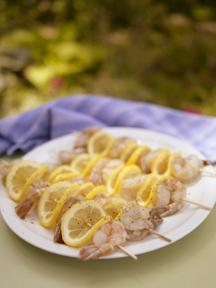 Raw Shrimp and Lemon Skewers Ready for the Grill