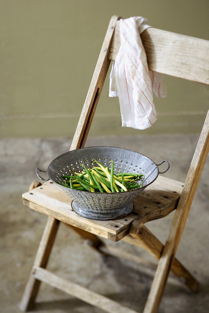 Colander of Green and Wax Beans on a Chair