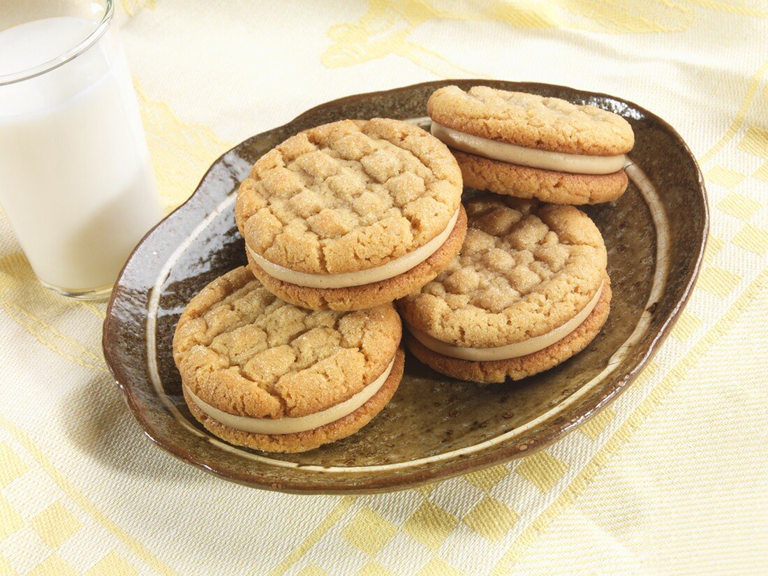 Peanut Butter Sandwich Cookies on a Plate, Glass of Milk