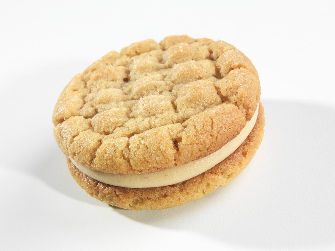 A Single Peanut Butter Sandwich Cookie on a White Background