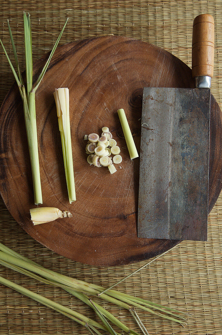 Lemon Grass, Whole and Sliced on a Cutting Board, Butcher Knife