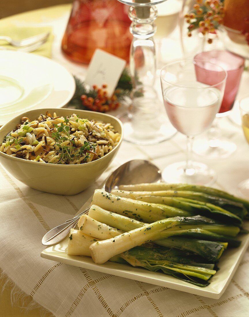 Roasted Leeks and Wild Rice Salad in Serving Dishes on Table