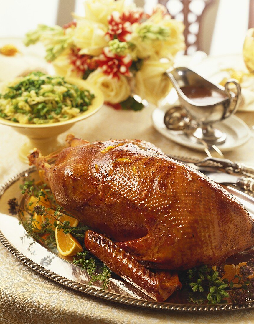 Whole Roasted Goose on a Silver Platter, Side Dish and Gravy Boat