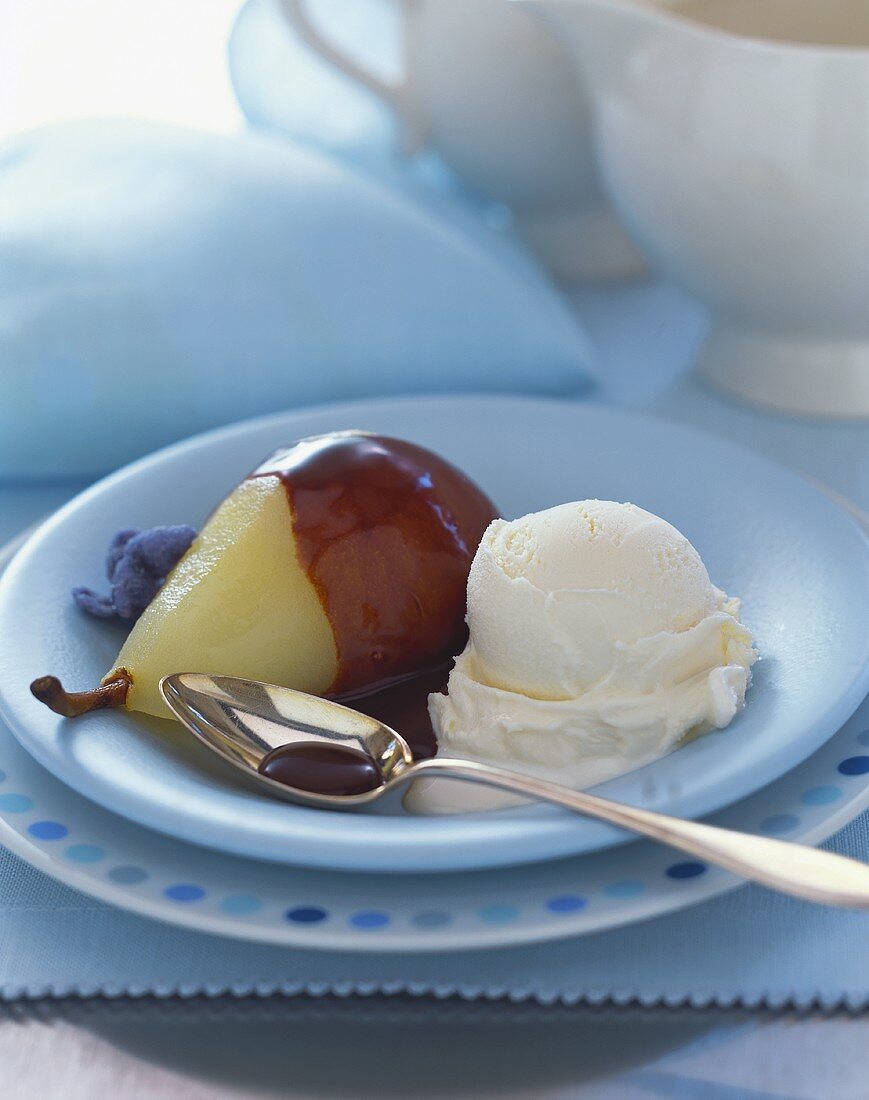 Poached Pear with Chocolate Sauce and a Scoop of Vanilla Ice Cream, Spoon