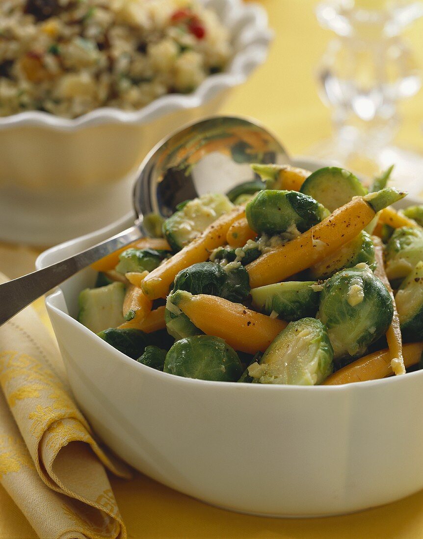 Brussels Sprout and Carrot Side Dish in a Serving Bowl with Serving Spoon