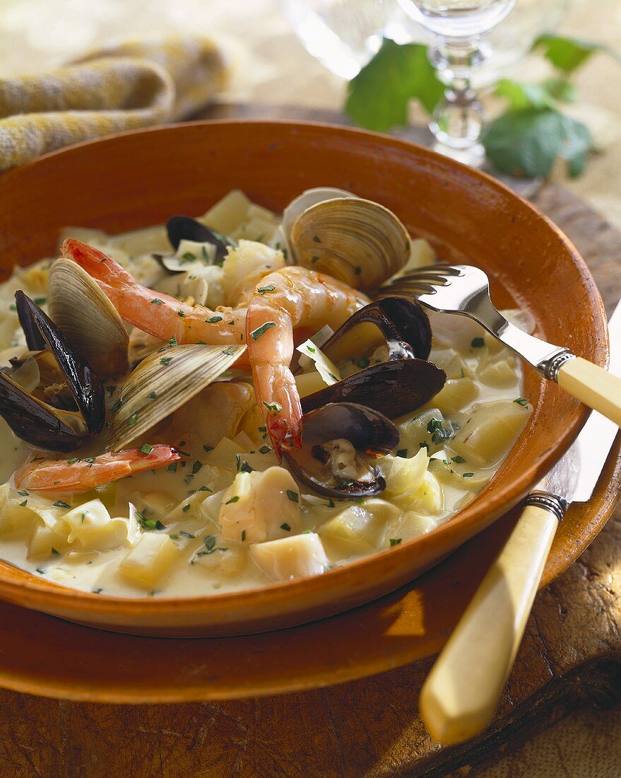 Bowl of Hearty Seafood Stew with Fork