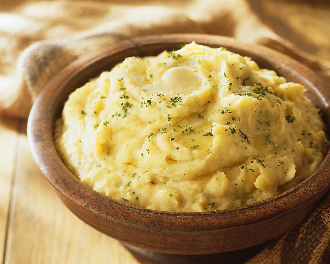 Bowl of Mashed Potatoes with Butter and Parsley