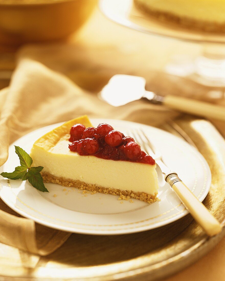 Slice of Cranberry Cheesecake on Gold Rimmed Plate, Fork