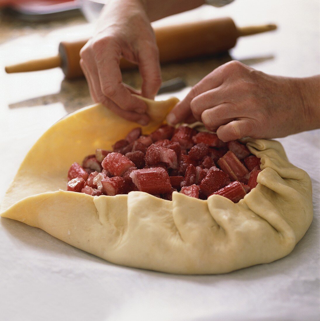 Making a Rhubarb Tart, Hands Forming Crust