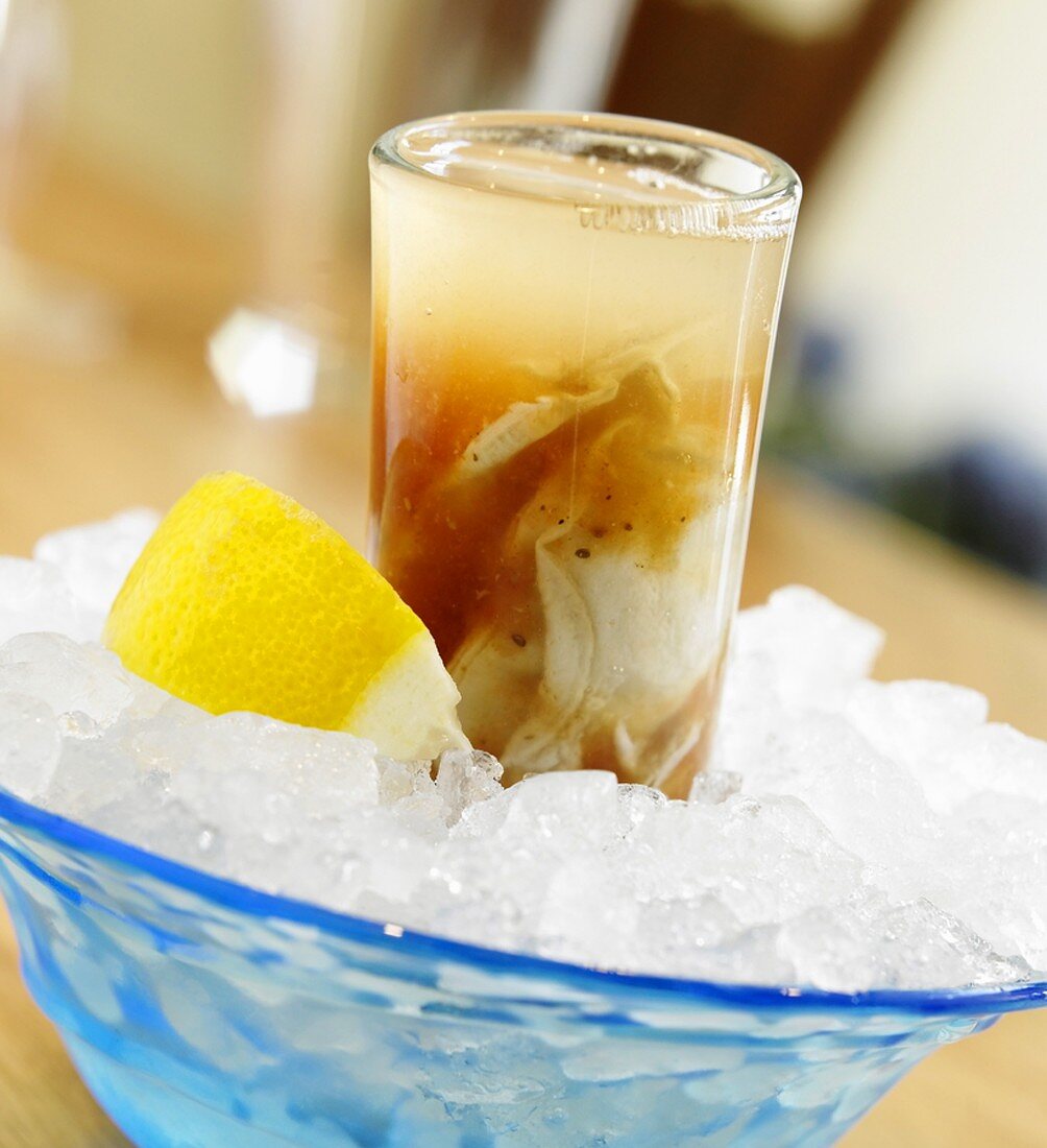 An Oyster Shooter on Ice with Lemon