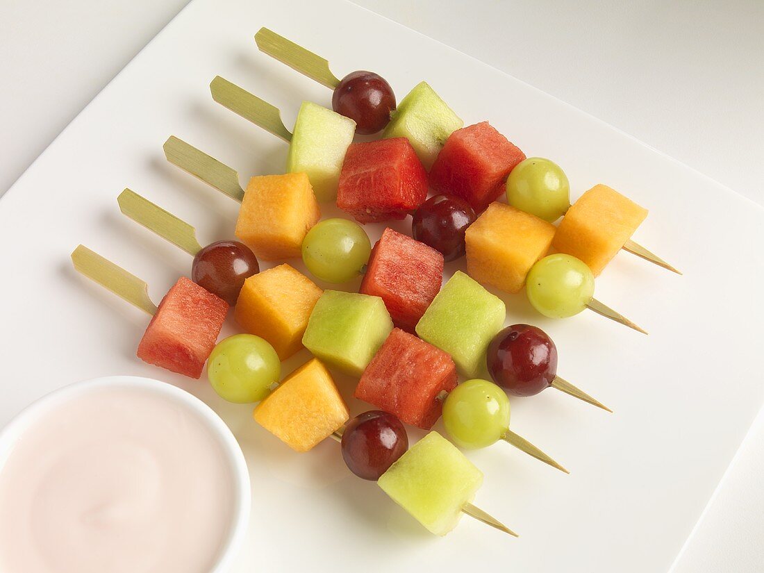 Fruit Skewers on a Plate with Raspberry Yogurt Dip