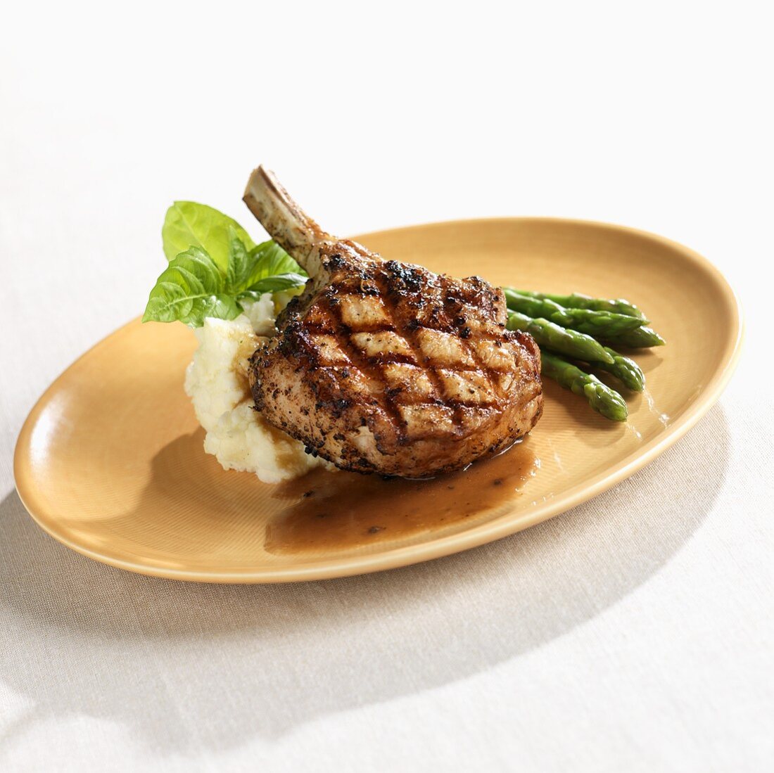 Fire Grilled Veal Chop with Mashed Potatoes and Asparagus