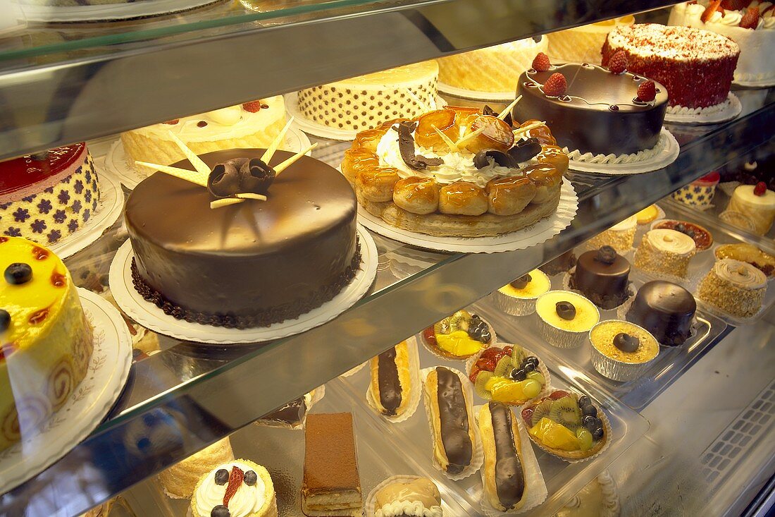 Large and small cakes on display in a confectioner's shop