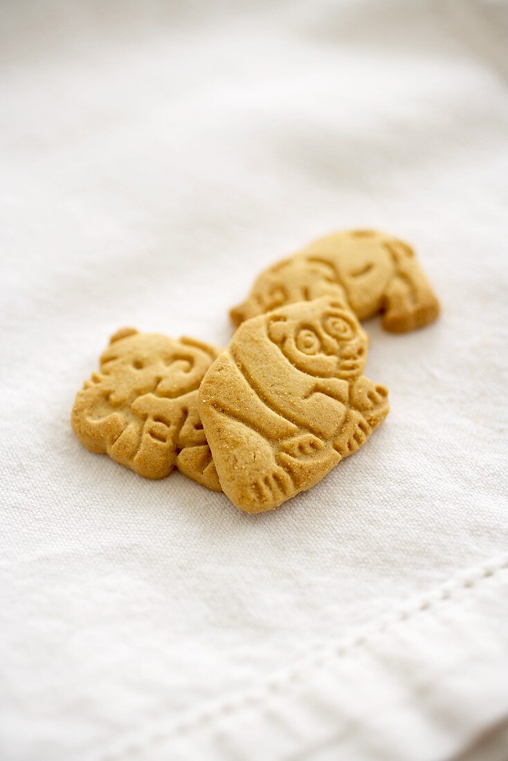 Three Animal Crackers on White Cloth