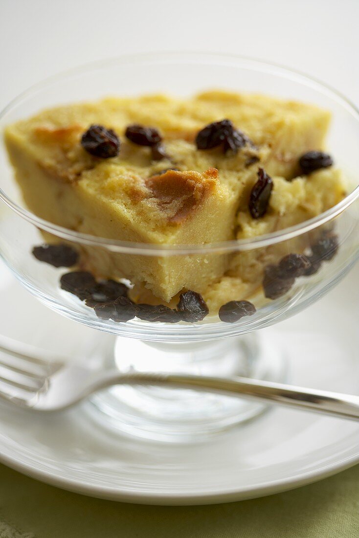Piece of Bread Pudding with Raisins in a Dessert Bowl