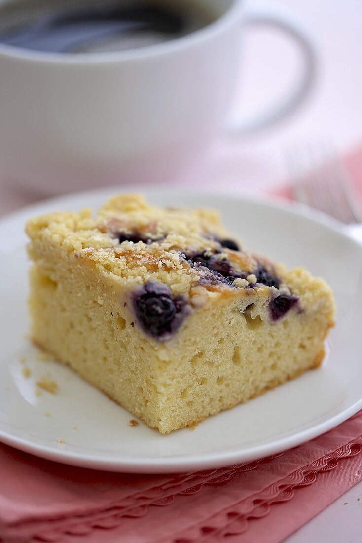 Piece of Blueberry Crumb Coffee Cake; Cup of Coffee