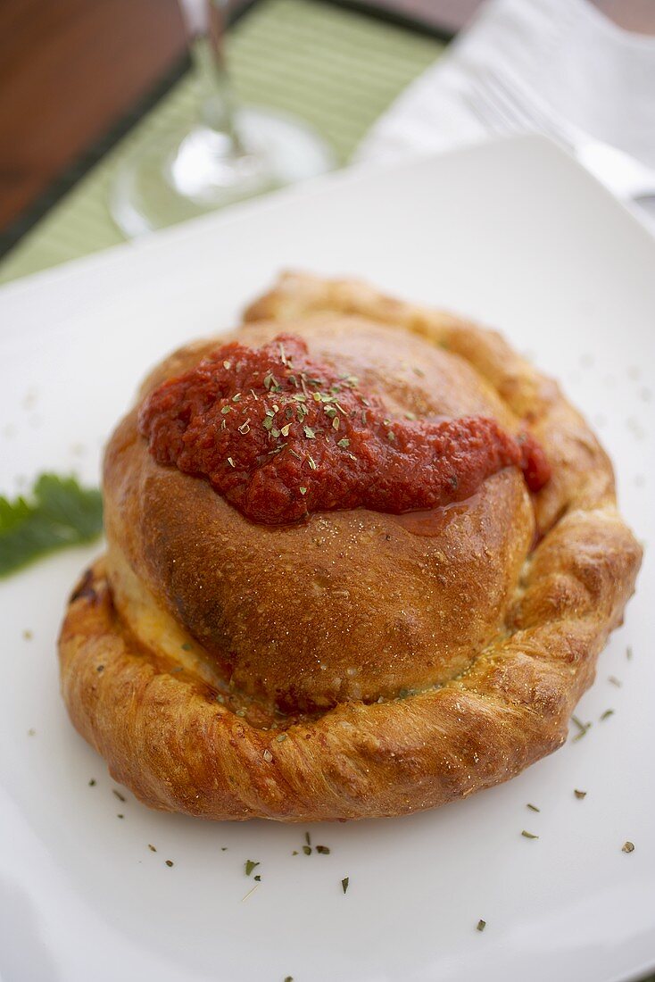 Pepperoni and Mozzarella Cheese Calzone with Tomato Sauce